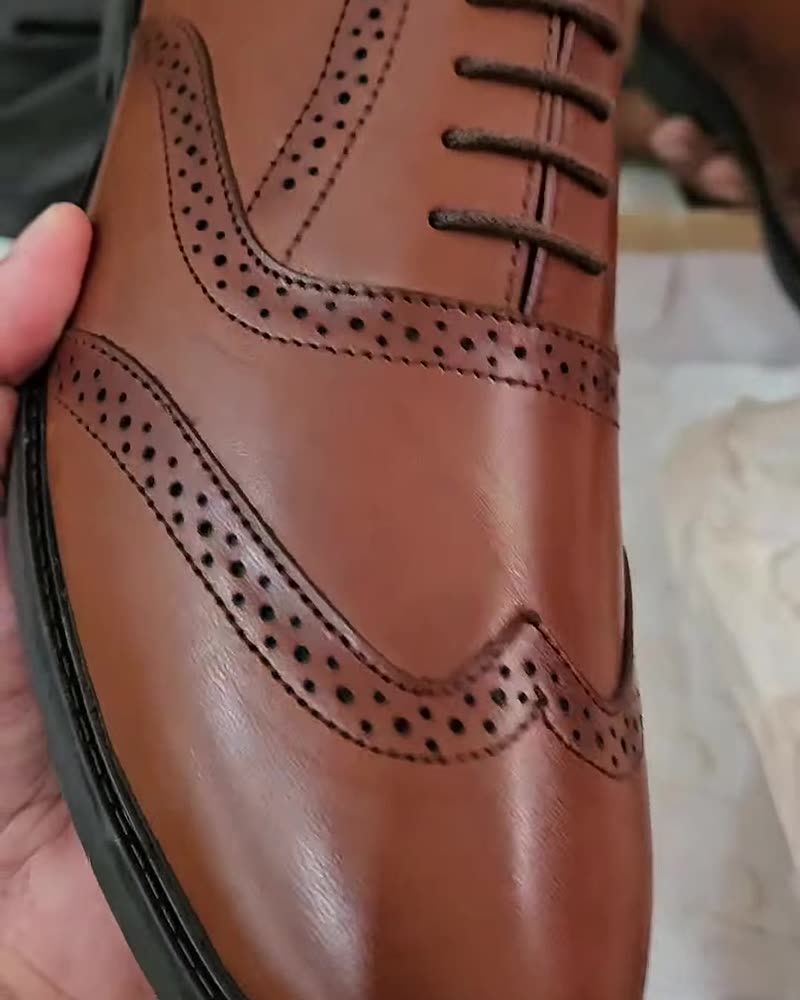 Tan wingtip brogue, side view