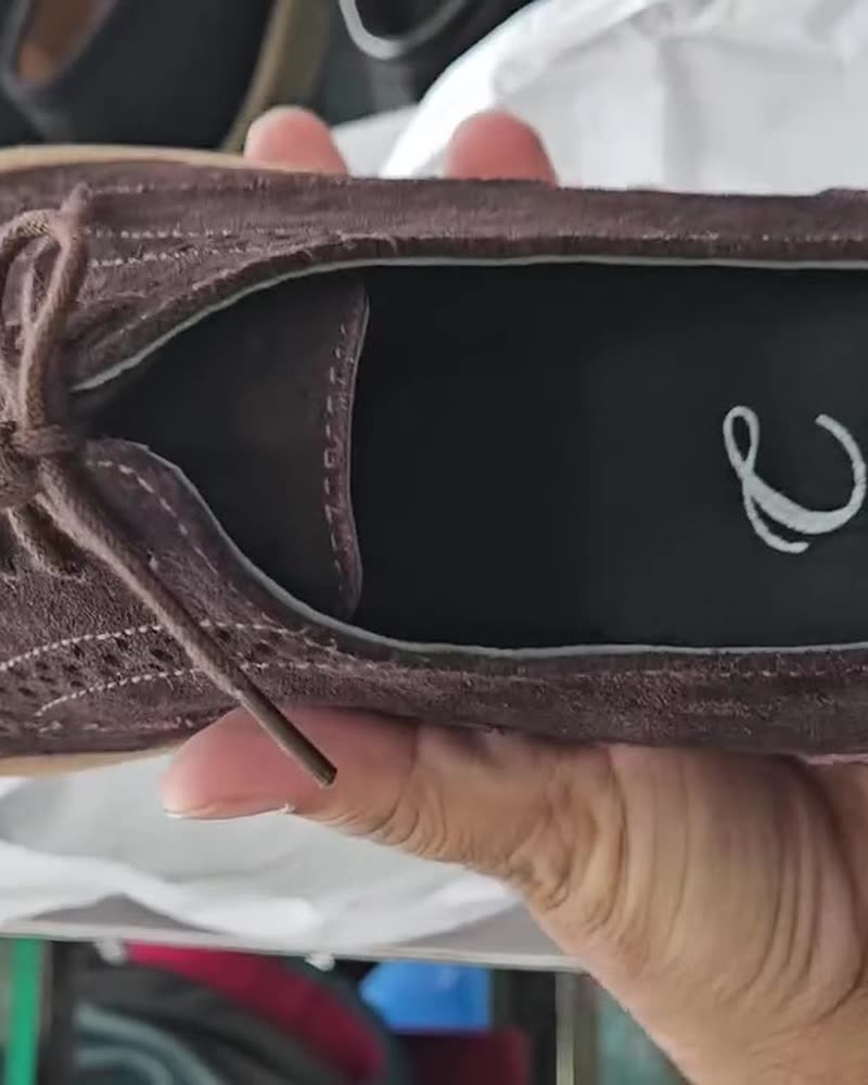 Brown suede wingtip derby with light sole